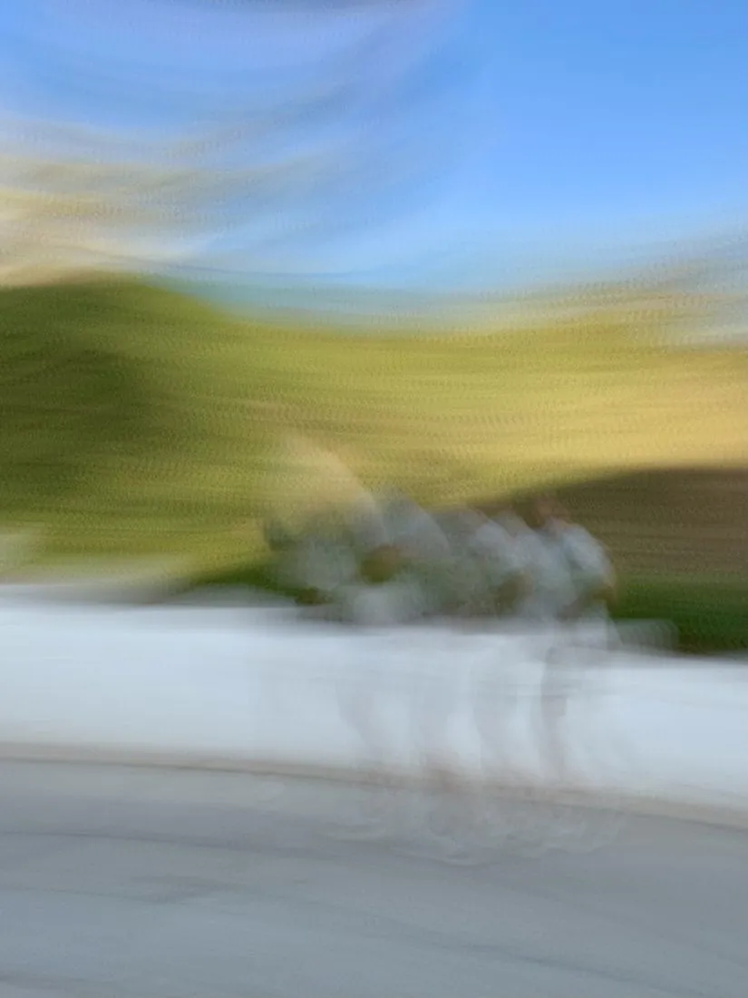Two runners on a sunny path, softly blurred in motion